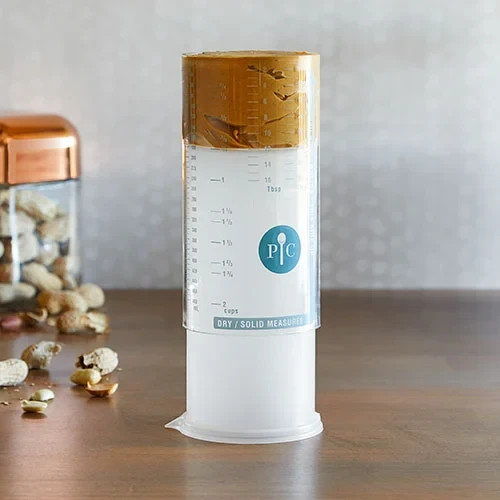 New Pampered Chef Measure All Cup Adjustable Plunger Design, 2 Cup Capacity 2225