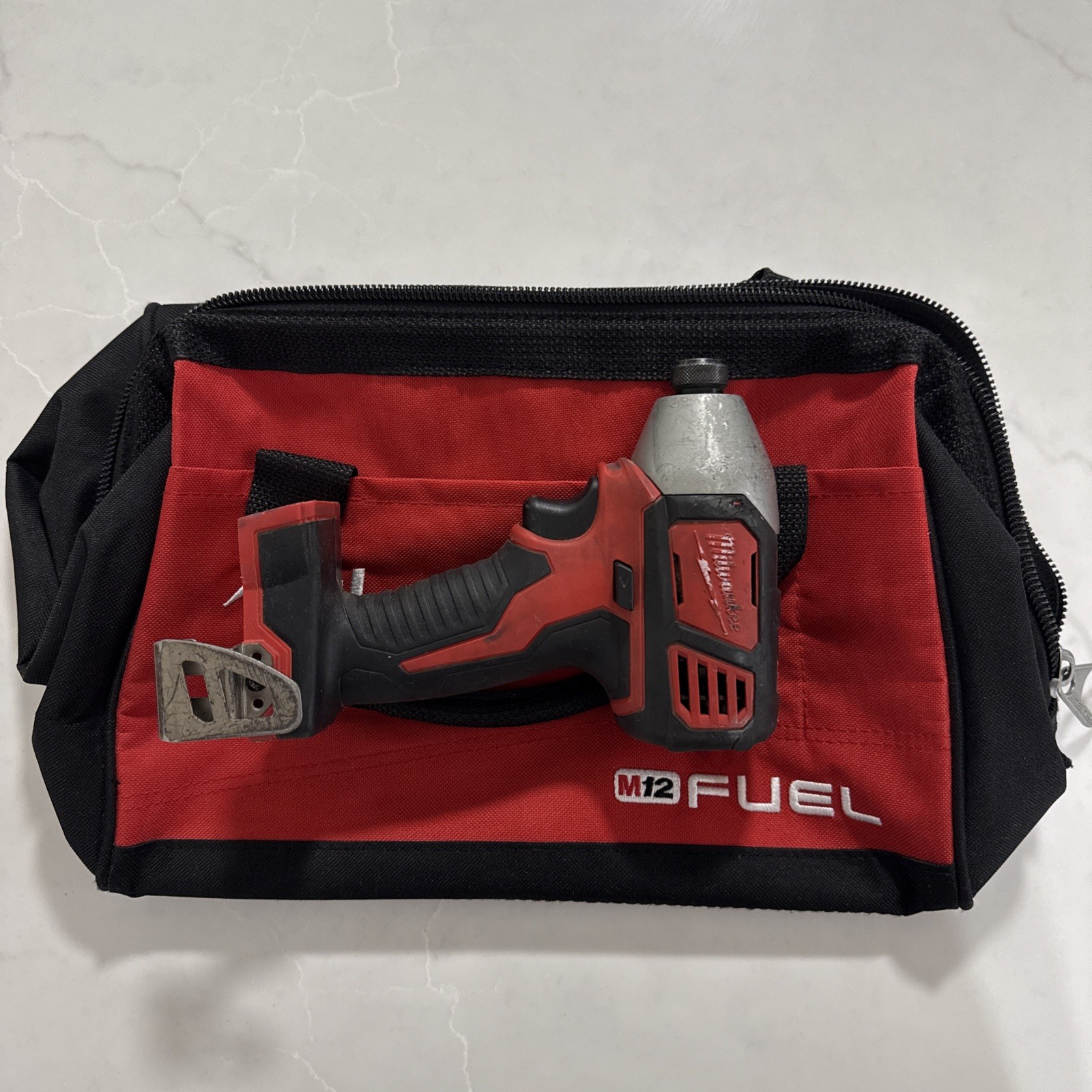 Milwaukee 2656-20 M18 Impact Driver 18V 1/4″ Hex and tool bag no battery