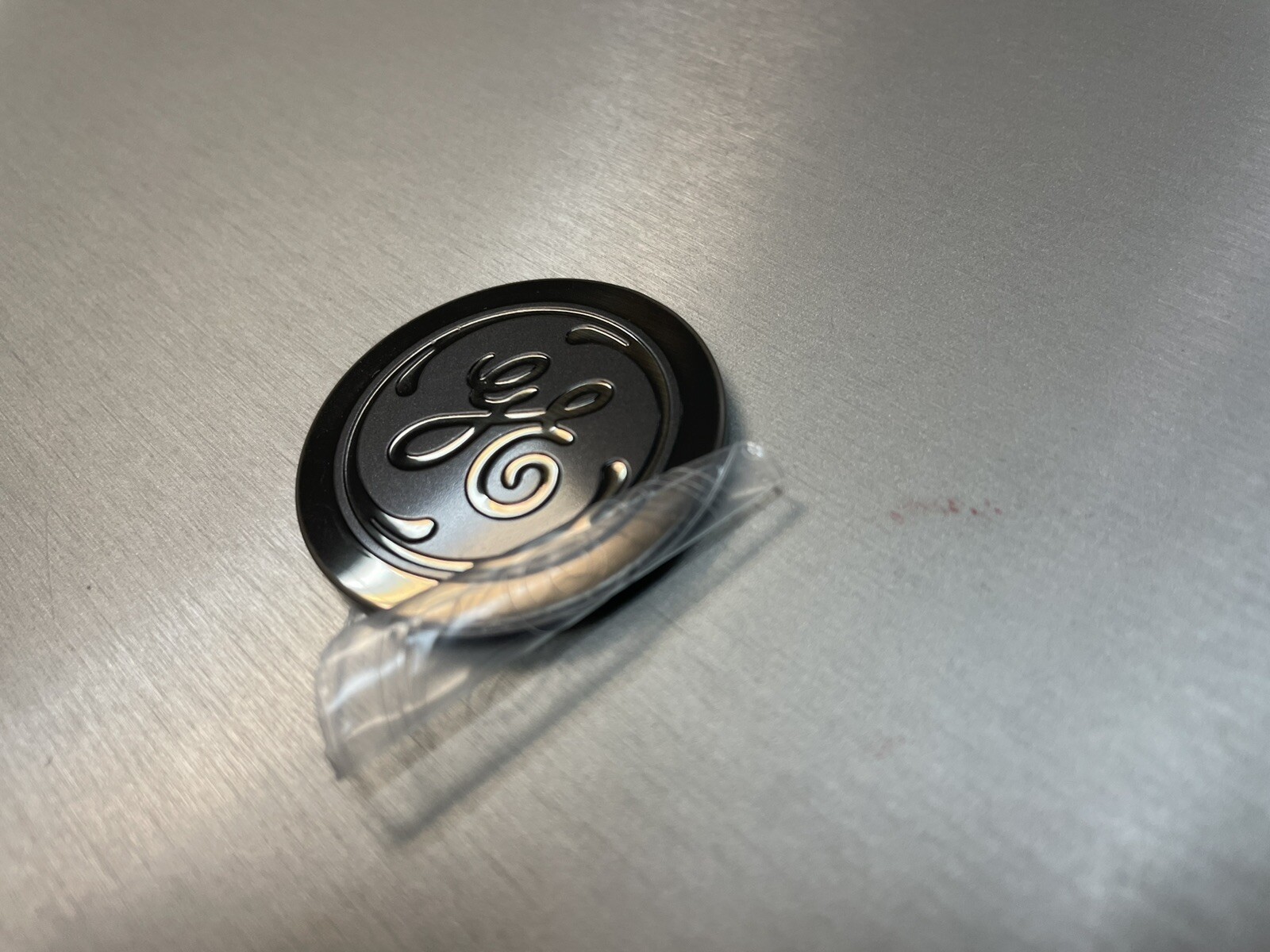 GE Dark SS Flat Badge WR02X38878, 1.50″DIAx 0.08″, compatible w WR02X31104, New